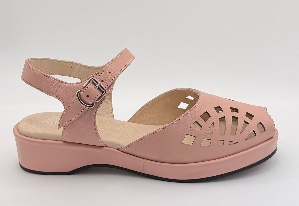 A single women's wedge sandal in dusty pink, featuring a cutout design on the toe and side, an adjustable ankle strap with a silver buckle, and a thick platform sole, shown against a light gray background.